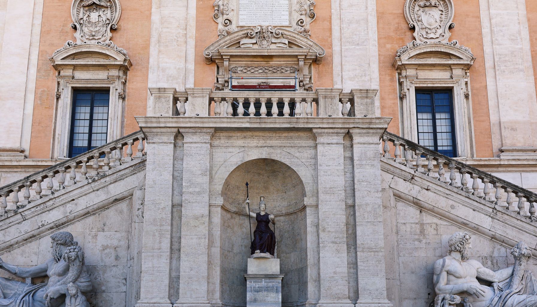 Explore the historic facade and statues of Capitoline Hill in Rome, Italy.