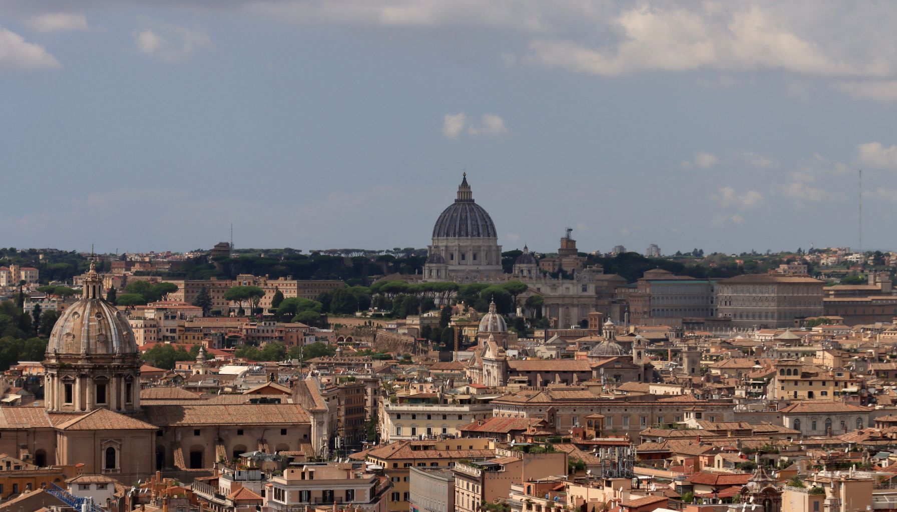 Scenic view of Rome's iconic skyline with famous landmarks and rooftops.