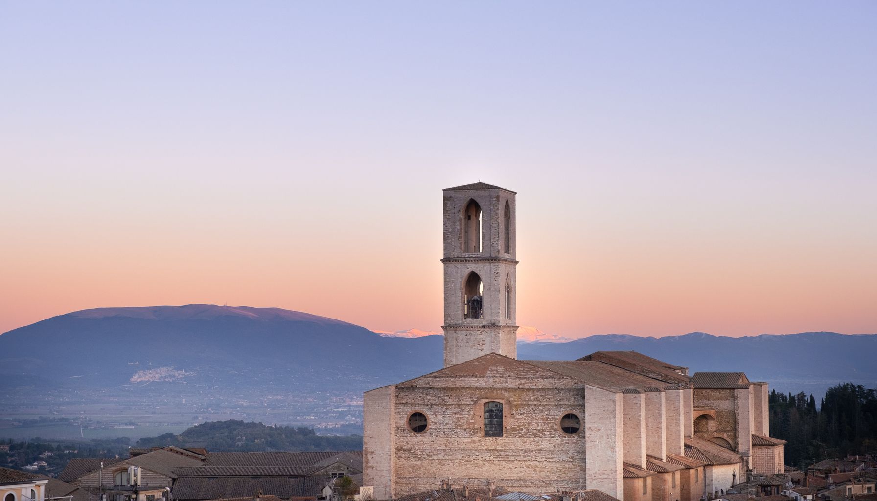 A stunning aerial view of the San Domenico Basilica at dawn in Perugia, Italy.